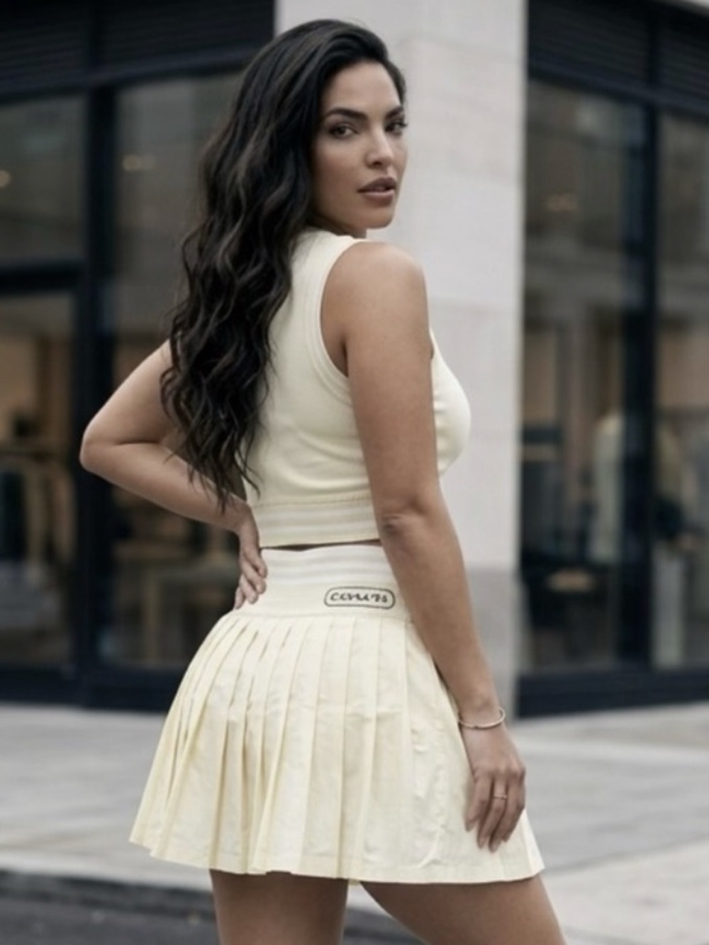 Yoga Coach Cream Pleated Mini Skirt with tank top scroll for more pictures